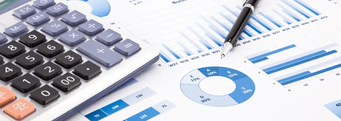 Image of a calculator and papers with graphs